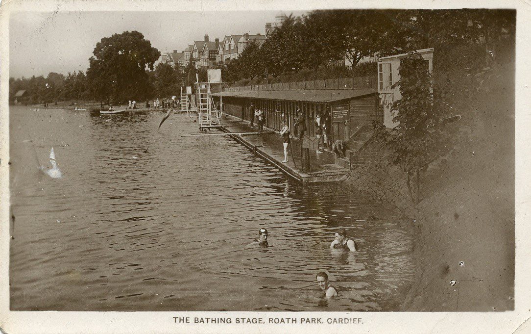 Bathing huts 2 historic photo showing bathing huts at Roath Park lake with swimmers