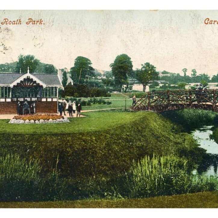 historic postcard showing an old wooden bridge over the brook in Roath Park