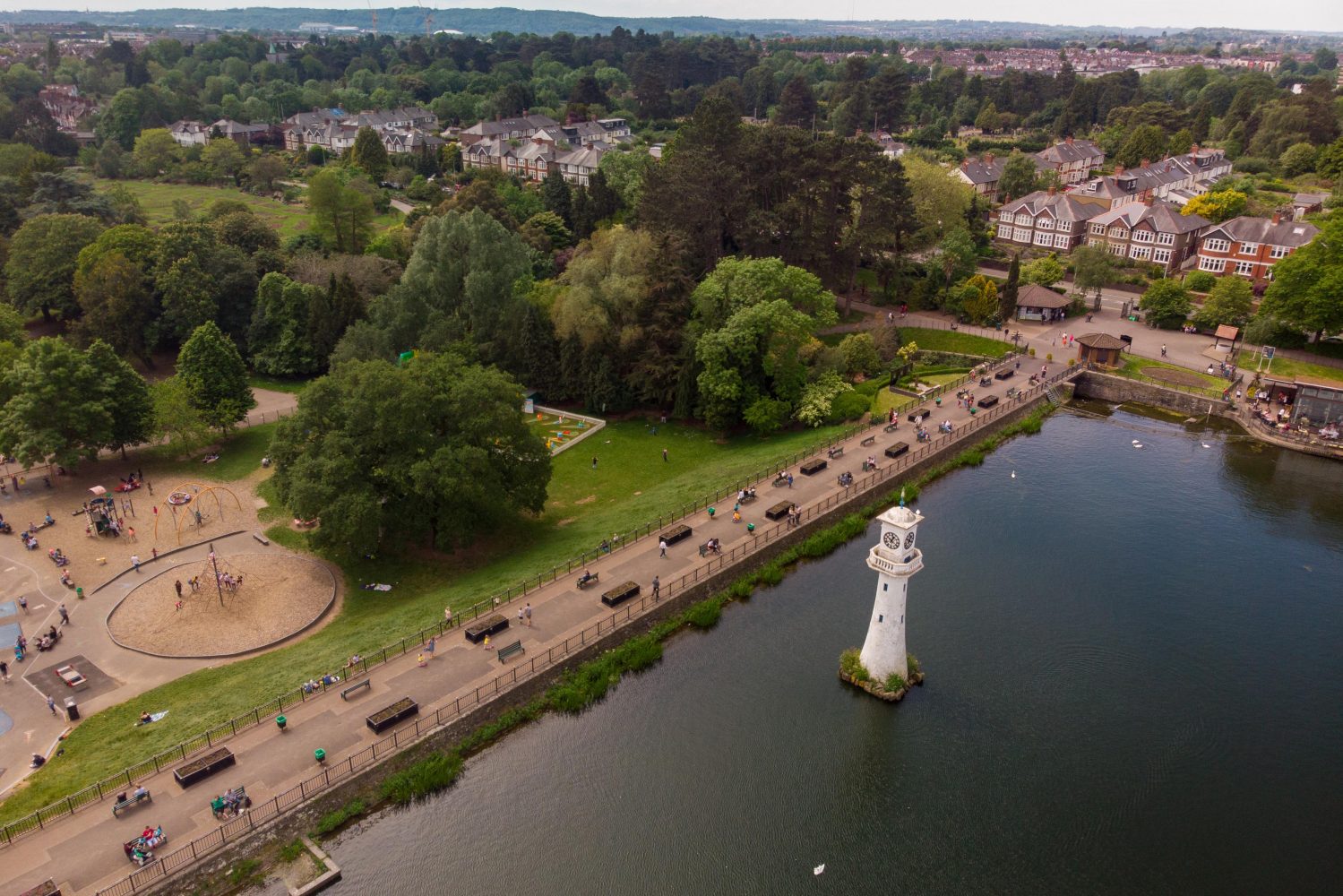 Roath park dam with lighthouse and play park